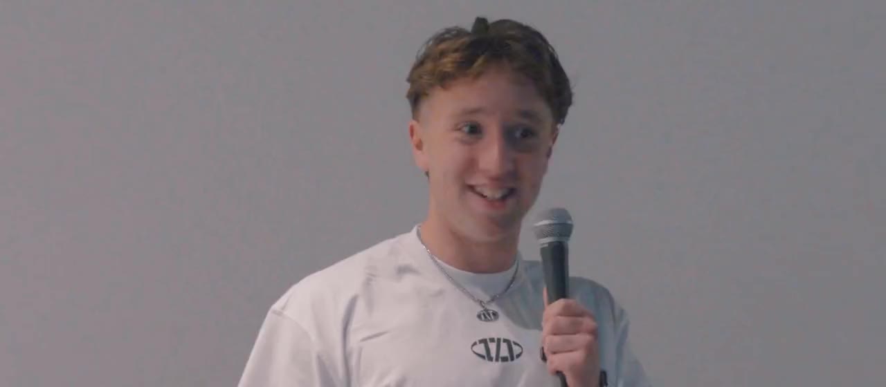 Seth telling his story on stage